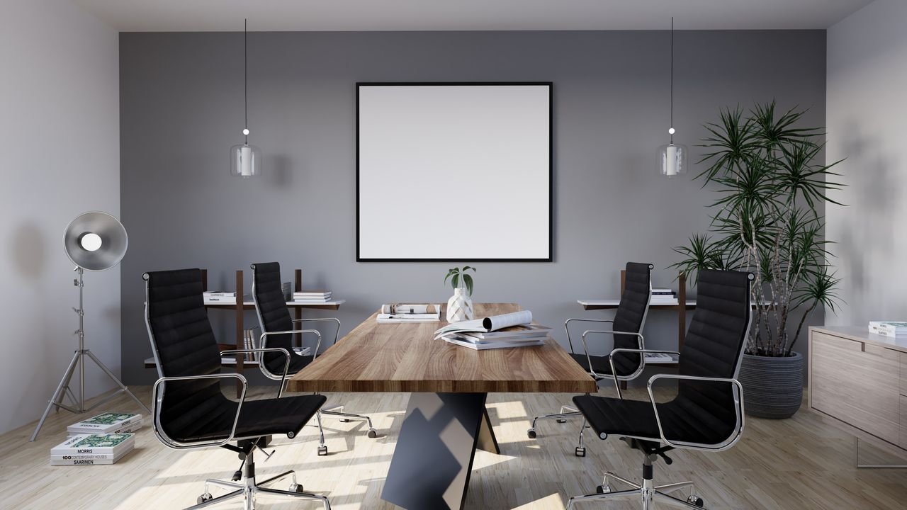 Sleek and modern conference room with minimalist design featuring stylish furniture and indoor plants.
