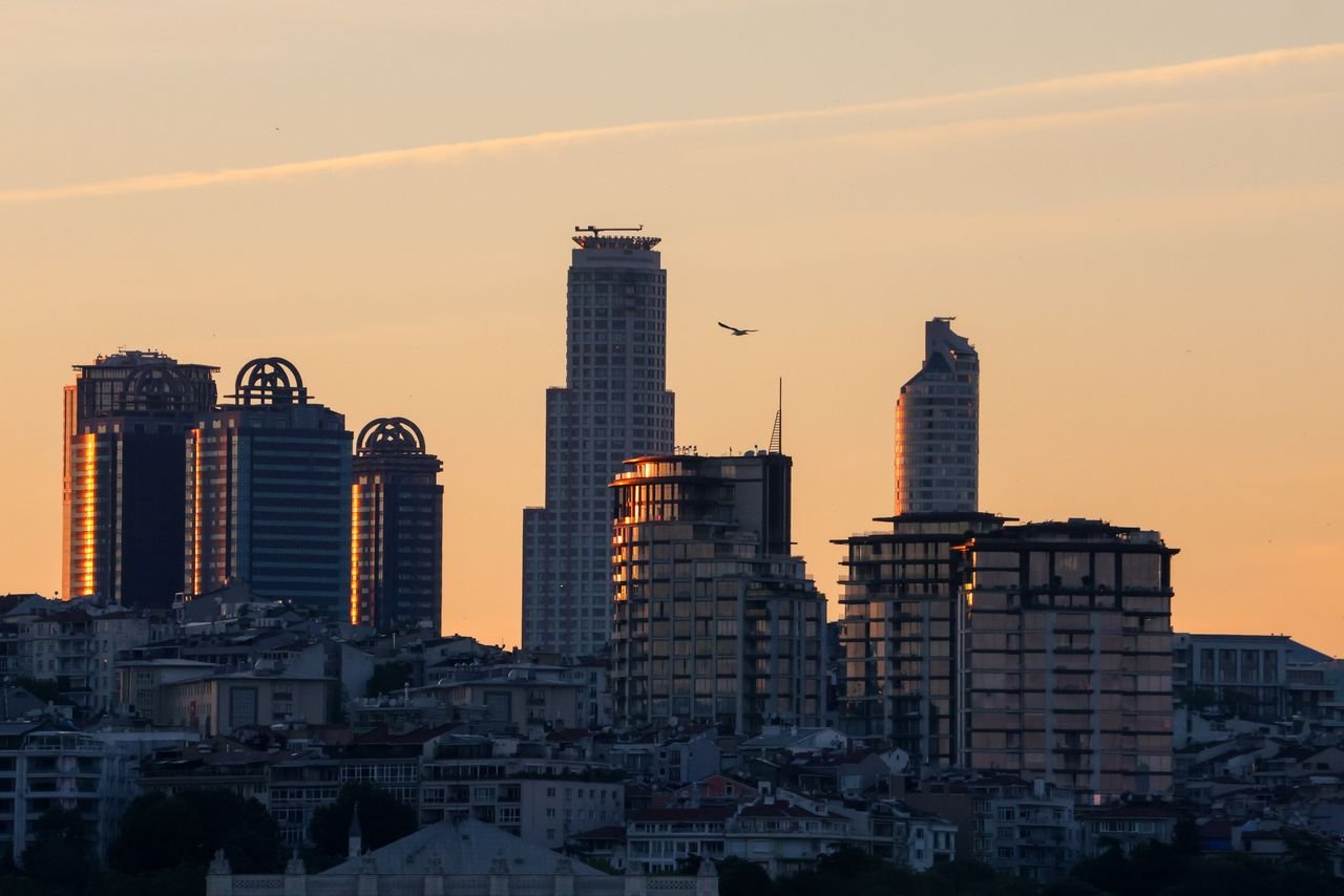 A breathtaking view of Istanbul's skyscrapers silhouetted against a vibrant sunset.